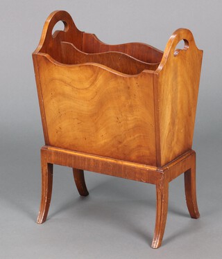 A rectangular walnut 2 division, twin handled, Canterbury, raised on outswept supports 56cm h x 38cm w x 24cm 