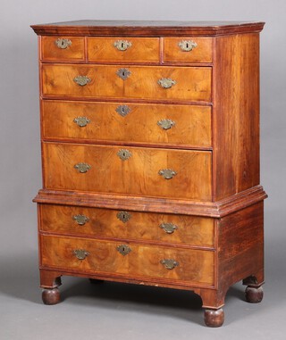 A Queen Anne crossbanded walnut chest on chest with moulded cornice fitted 3 short and 3 long drawers, the base fitted 2 long drawers, raised on bun feet 143cm h x 102cm w x 54cm d 