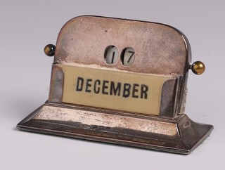 An arch shaped silver perpetual calendar Birmingham 1927 by Wilmot Manufacturing Company 6cm x 9cm x 4cm 