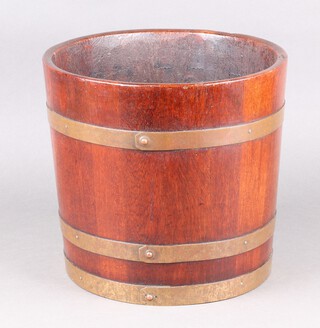 A 1920's coopered oak and brass banded jardiniere 28cm h x 31cm diam. 