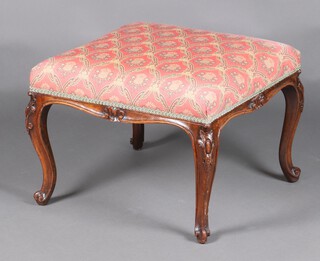 A Victorian carved mahogany square show frame stool the seat upholstered in pink floral material, raised on cabriole supports 43cm h x 57cm  