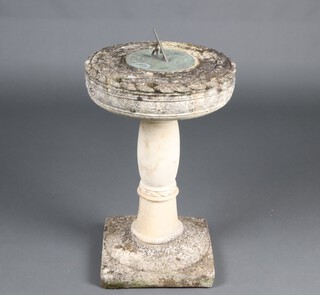 A metal sun dial, raised on a well weathered concrete column with square base 65cm x 34cm (in 2 sections) 