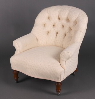 A Victorian tub back chair upholstered in white buttoned material, raised on turned supports 75cm h x 71cm w x 64cm d 