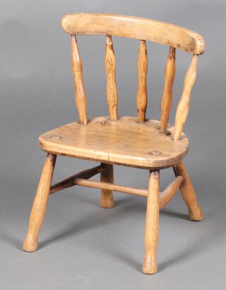 A child's 19th Century beech stick and rail back chair with solid seat, raised on turned supports with H framed stretcher 44cm h x 30cm w x 22cm d 