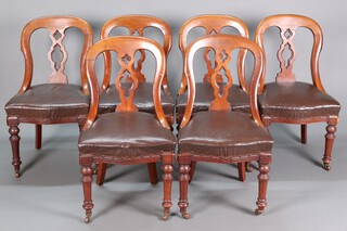 A set of 6 Victorian pierced mahogany splat back dining chairs with overstuffed seats, raised on turned supports with ceramic casters 