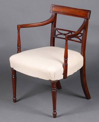 A 19th Century mahogany pierced bar back desk/carver chair, the seat upholstered in leather, raised on turned supports 79cm h x 58cm w x 48cm d 