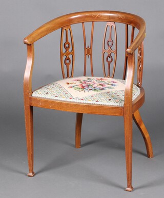 An Edwardian inlaid mahogany tub back chair, the seat with Berlin wool work panel raised on square tapered supports 73cm h x 53cm w x 44cm d 