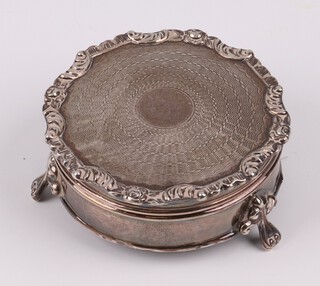 A silver dressing table jar with engine turned lid on panel supports Chester 1924 by Charles Cooke 6cm, 86 grams including liner 