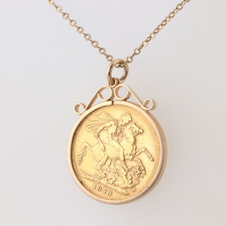 A Victorian 1873 gold sovereign in a pendant mount, hung on a yellow gold, testing as 14ct, chain 52cm 