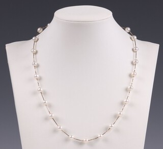 A yellow gold, marked 14k, gold and interspersed pearl necklace gross weight 7.9 grams 