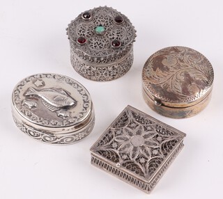 An oval 925 silver trinket box the lid decorated a fish with plush interior 3.5cm, a circular ditto the lid engraved leaves 3cm, a Continental pierced silver filigree box 3cm, 47 grams and a square pierced filigree box  