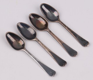 Four miniature silver table spoons, bottom marked, 12 grams 