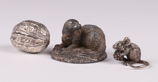 A silver figure of a mouse with blackberry 2cm 17 grams, a 925 silver trinket box in the form of a walnut 20 grams and a cast silver figure of an otter Birmingham 1991 