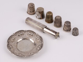 Two silver thimbles 10 grams, 4 other thimbles, a white metal lipstick case a ditto embossed dish