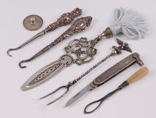 A 925 silver golf ball marker, a miniature folding pocket knife with silver grip Birmingham 1947 5cm, 2 miniature silver handled button hooks, a metal fork and a pierced metal bookmark 