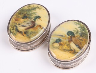 A pair of 925 silver pill boxes the lids with porcelain panels decorated ducks 4cm 