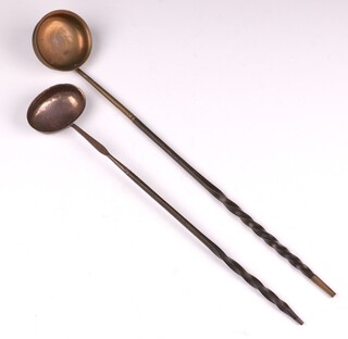 A Georgian silver ladle with whalebone twist handle, London 1804, together with a gilt metal ditto 