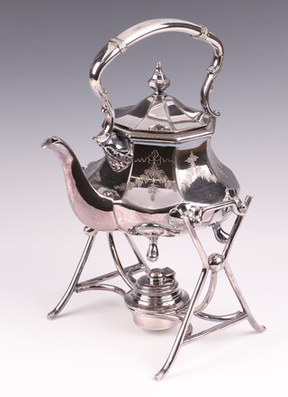 A Victorian Britannia metal spirit kettle and stand complete with burner 