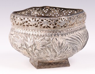 An Eastern pierced and embossed white metal vase 10cm  