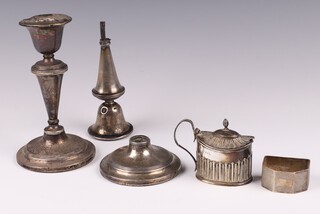 A silver napkin ring Birmingham 1944, an oval embossed silver mustard (marks rubbed) 73 grams and 2 silver candlesticks 15cm (1 a/f) 