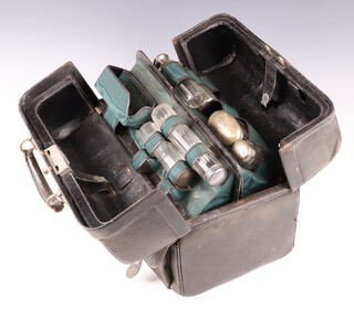 Two Victorian silver faceted glass pin jars with silver lids London 1879 and 4 other dressing table jars with silver lids, contained in a leather case 