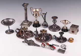 A pair of silver plated chamber sticks with snuffers, silver plated taper stick and sniffer, letter clip in the form of a greyhounds head set hardstone eyes and other items of silver plate 