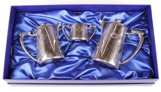 A Mappin & Webb 3 piece hotel ware tea service with 2 hot water jugs and a twin handled sugar bowl marked Blue Star Line 