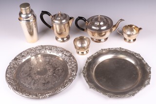 A 4 piece silver plated tea service with teapot, hot water jug, milk jug and sugar bowl, silver plated cocktail shaker, platter and 1 other 