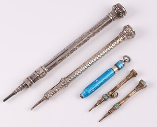 Two gilt metal and turquoise propelling pencils, a silver cased propelling pencil, a blue and white enamelled polka dot propelling pencil (enamel damaged) and 1 other 