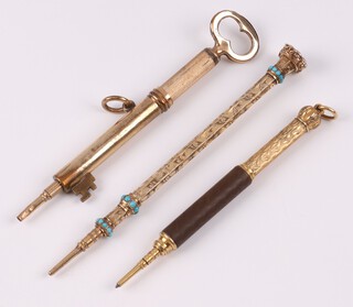 A gilt metal propelling pencil in the form of a key, an engraved ditto marked P & G. 12.C with turquoise decoration and 1 other 