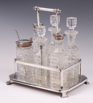 A Victorian cut glass and silver plated 6 piece cruet set on a lozenge shaped plated stand 21cm 