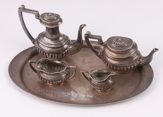 A miniature 4 piece tea service with teapot, coffee pot, sugar bowl and milk jug Birmingham 1937 together with a matched silver oval tea tray Birmingham 1974 10cm by S J Rose & Sons, 62 grams 
