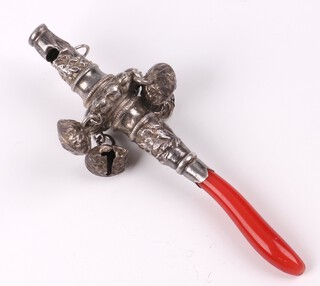 A child's Victorian embossed white metal rattle with coral teething bar and bells 9cm 