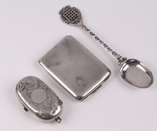 A Victorian oval engraved silver double sovereign case London 1864 (damage to top), an Edwardian silver spoon decorated the Arms of Parliament London 1907 and a silver match slip Birmingham 1928, 74 grams 
