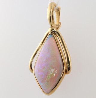 A tear drop shaped polished "opal" pendant contained in an 18ct gold mount, 12.7 grams gross 
