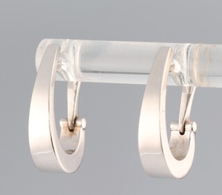 A pair of 9ct white gold hoop earrings 1.8 grams 