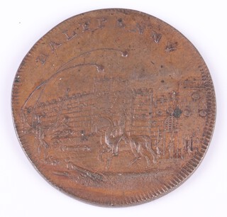 A Sussex 1795 half penny token produced at Brighton. One side depicts the storming of the Bastille; the other side is bisected and shows three warships above a military trophy. Very fine condition. Grade F-VF