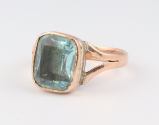 A 19th Century yellow gold, testing as 9ct dress ring set a blue foil backed stone, size L 2.7 grams  