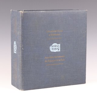 A collection of 36 Franklyn Mint first day covers commemorating The International Society of Postmasters dated late 1970's, each with a Sterling silver commemorative medallion, all contained in a gilt and cloth bound lever arch file 