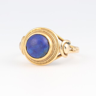 A 19th Century yellow gold, testing as 18ct dress ring set a blue cabochon cut stone, size K 1/2, 3 grams 