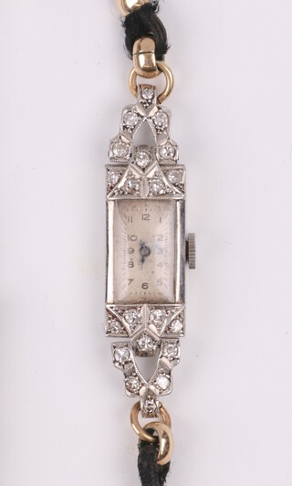 A lady's 1930's Swiss platinum and diamond set cocktail wristwatch, the square white dial with Arabic numerals 