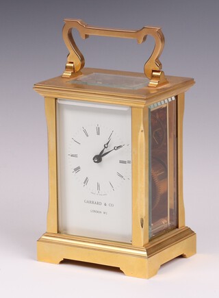 Garrard & Co., a 20th Century carriage timepiece with enamelled dial Roman numerals, the back plate marked Made in England, 11 jewels, complete with key. 11cm h x 8cm w x 6cm d 