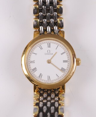 A lady's Omega DeVille quartz wristwatch with bi-metallic strap, with original box, label, International guarantee and spare links 
