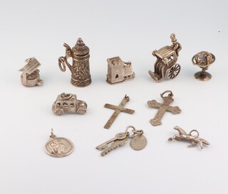 Two silver crosses, a silver St Christopher medal and 8 various silver charms 29.9 grams 