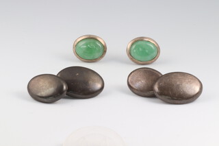 A pair of oval silver cufflinks 14.3 grams together with a pair of silver cufflinks set green polished hardstone 