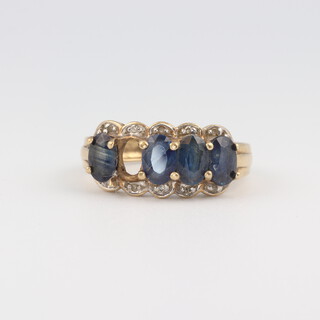 A 9ct yellow gold ring set sapphires and diamonds (1 sapphire missing), size N, 2.9 grams 