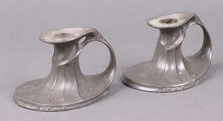 Hugo Leven for Kayserzinn, a pair of Art Nouveau pewter chamber sticks, the bases marked Kayserzinn 4449 
