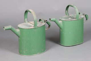 A pair of 19th Century green painted country house oval hot water carriers 45cm h x 47cm w x 19cm d 