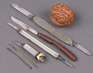 Butler of Sheffield, a folding scalpel marked Butler Sheffield England with plastic grip 9cm, a folding pocket knife the steel blade marked JoWlke Republic of Ireland, the grip decorated the dates of the Monarchs of England, a gilt cased cigar cutter with folding knife and mother of pearl grip, folding twin bladed knife, a carved walnut and 2 bodkins 