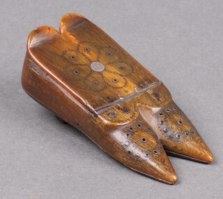 A 19th Century horn and wooden snuff box in the form of a pair of ladies shoes 7cm x 3cm 